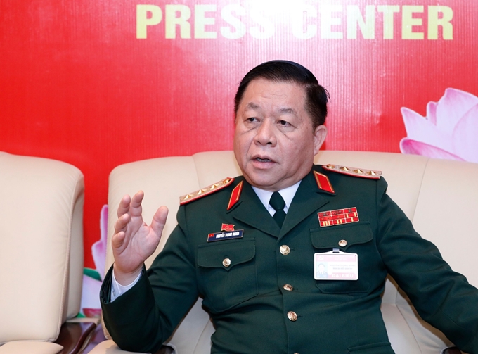 Thượng tướng Nguyễn Trọng Nghĩa chia sẻ với phóng viên tại Trung tâm Báo chí Đại hội XIII của Đảng. 